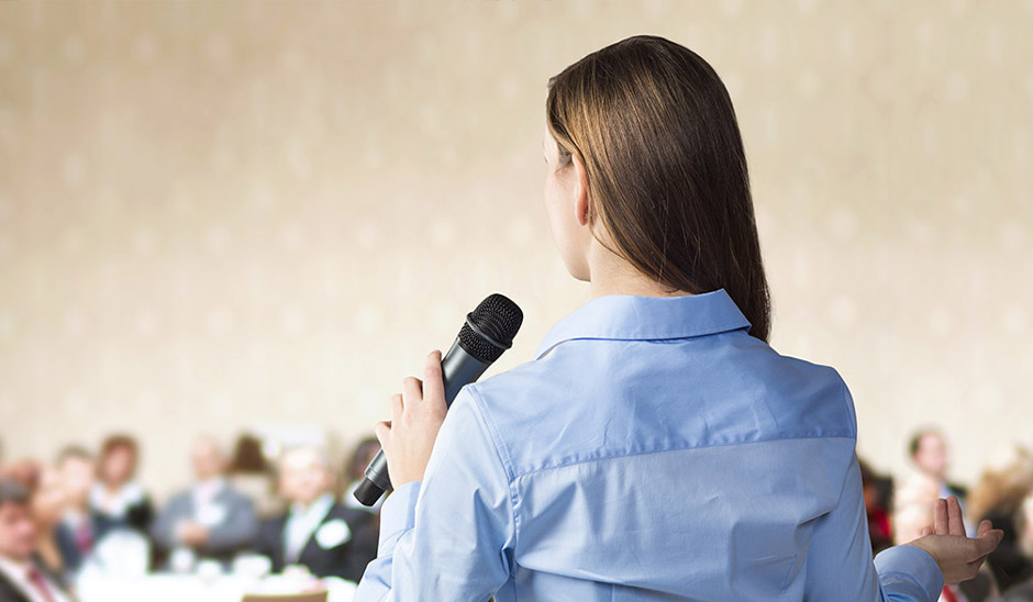 Female talking in front of audience