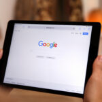 Google search homepage displayed on a tablet showing website search visibility