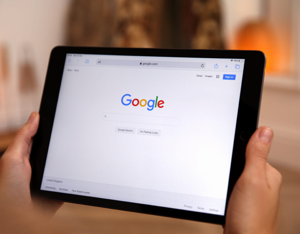 Google search homepage displayed on a tablet showing website search visibility