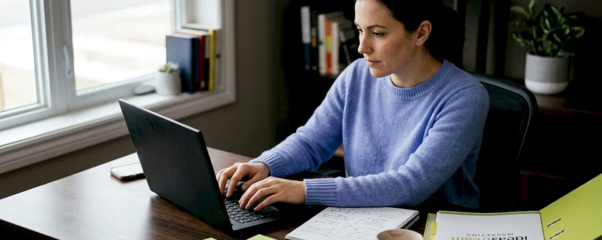 Woman scripting marketing video in home office