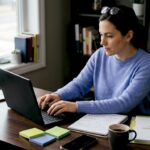 Woman scripting marketing video in home office