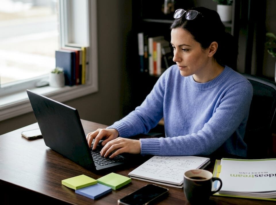 Woman scripting marketing video in home office