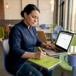 Restaurant owner analyzes marketing at table
