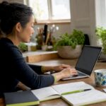 Businesswoman coding WordPress site in home office