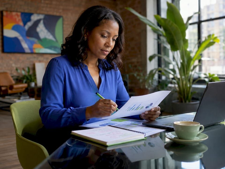 Businesswoman reviewing growth marketing charts