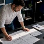Video producer planning storyboard in studio