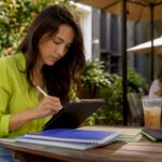 Social media manager planning workflow at coworking space