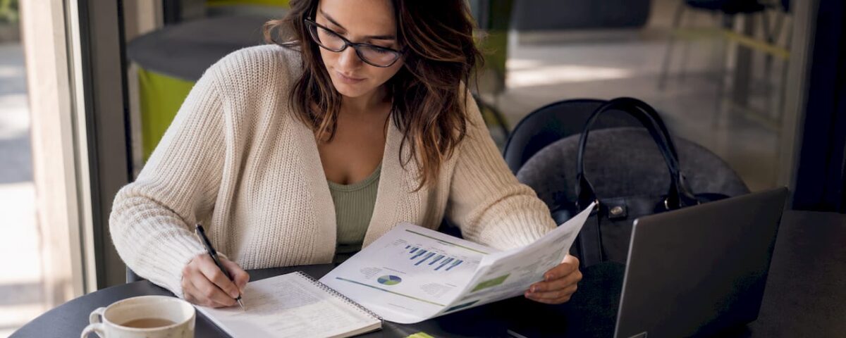1783765621537_Healthcare-content-strategist-reviewing-report-at-desk | Idea Stream Marketing Healthcare content strategist reviewing report at desk