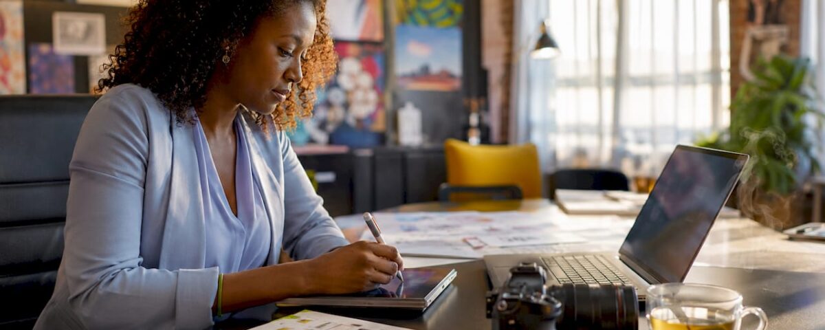 1783966753930_Woman-planning-video-marketing-checklist-at-home-desk | Idea Stream Marketing Woman planning video marketing checklist at home desk