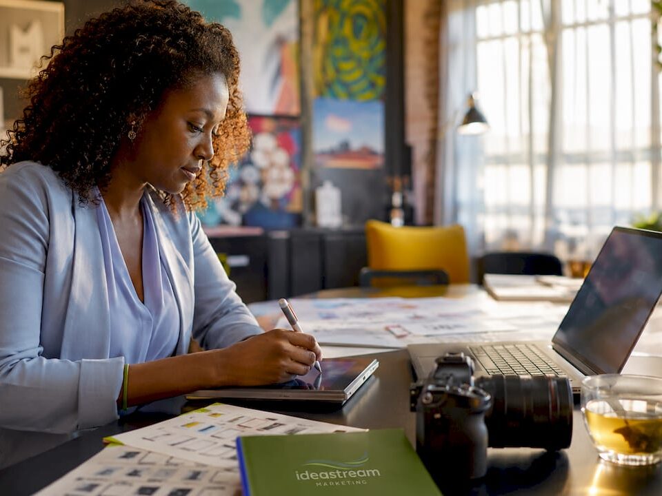 Woman planning video marketing checklist at home desk