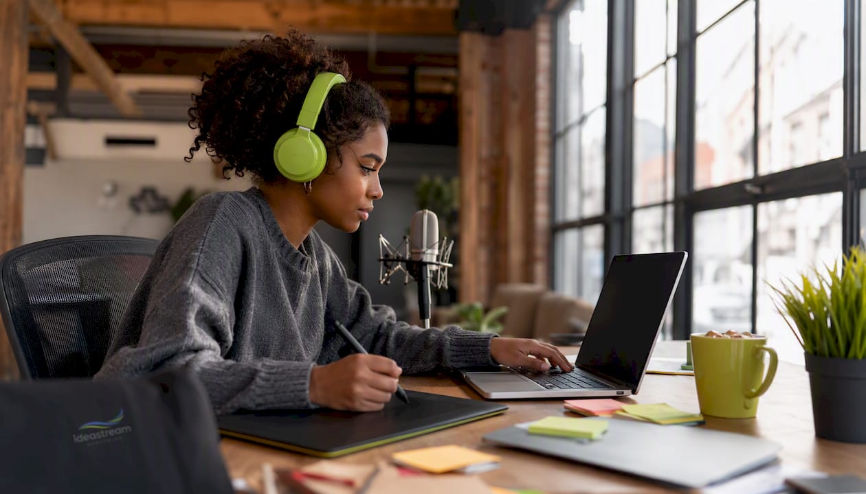 Content Creator Editing Video | Idea Stream Marketing Content creator editing explainer video in home studio
