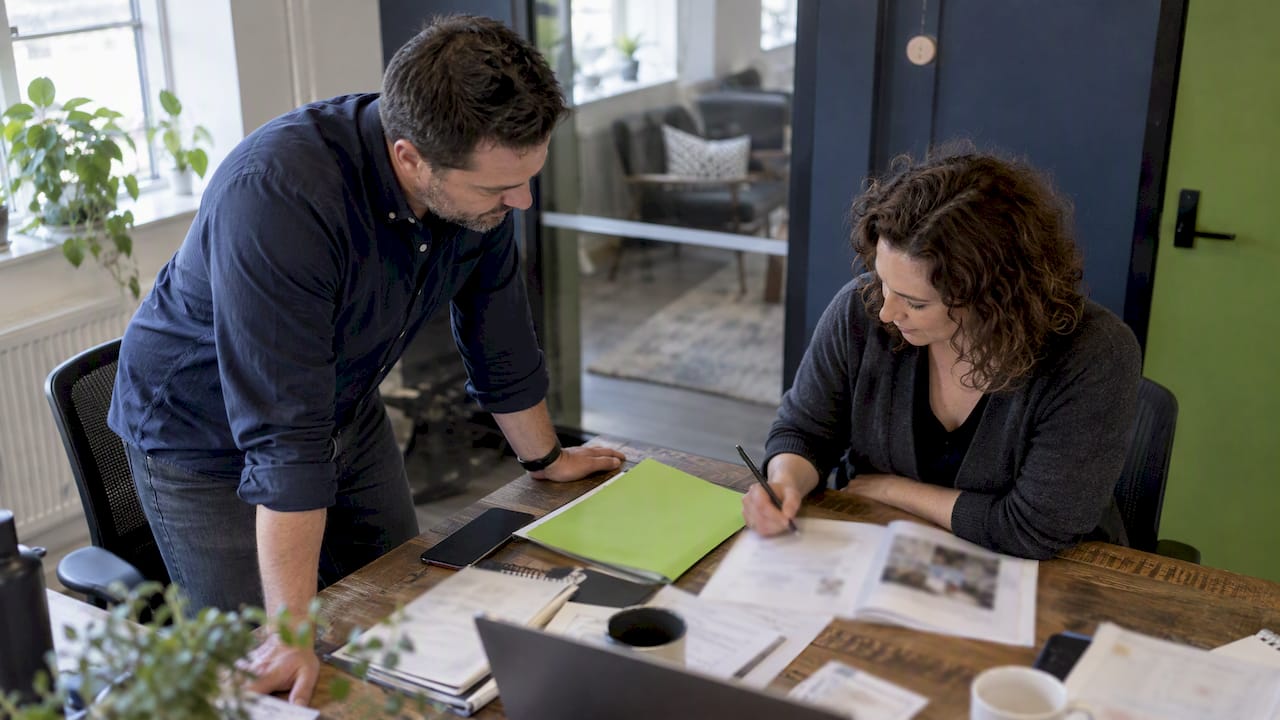 Owner and strategist reviewing messaging notes